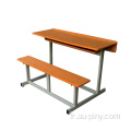 Bureau d'école double et chaise de banc attachés